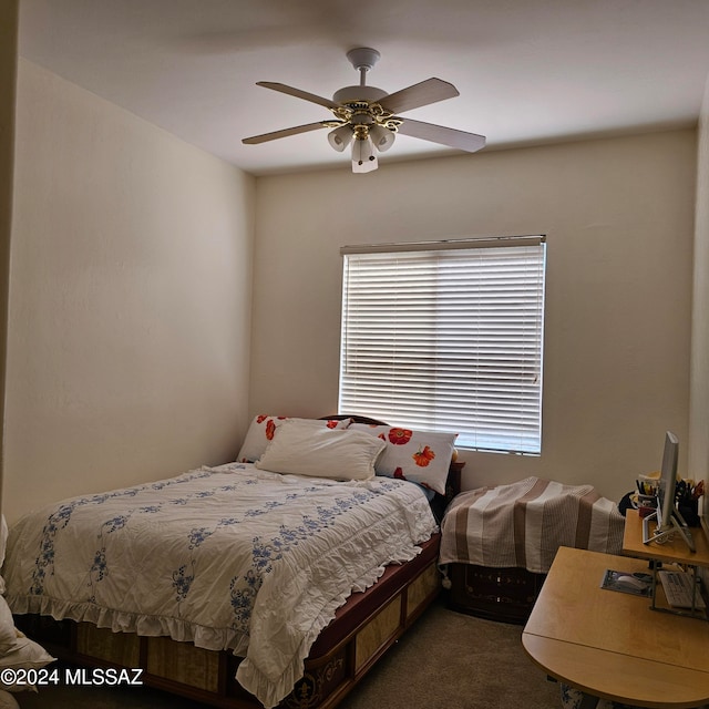 bedroom featuring dark carpet and ceiling fan