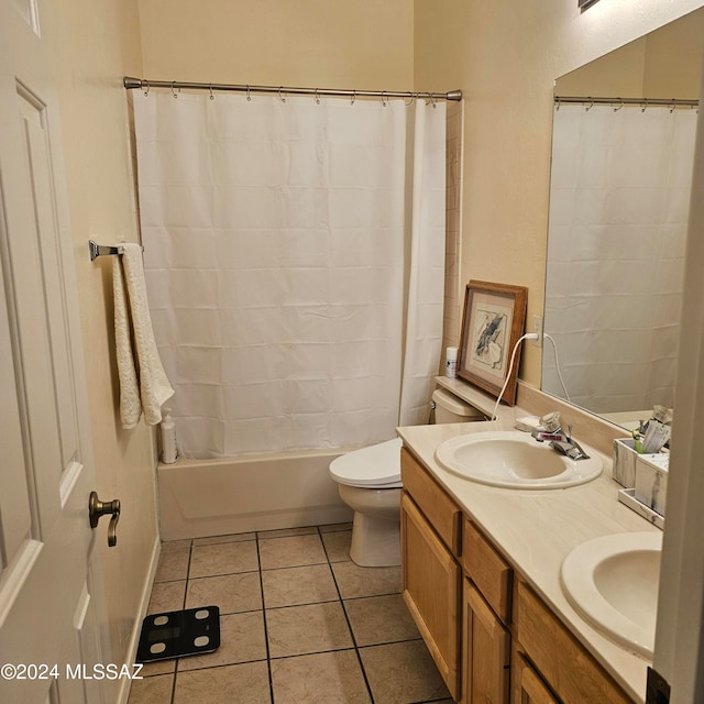 full bathroom featuring vanity, shower / tub combo with curtain, toilet, and tile patterned floors