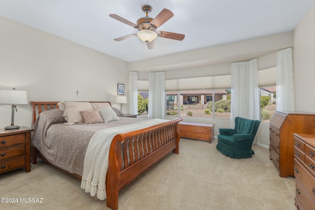 bedroom featuring ceiling fan and light colored carpet