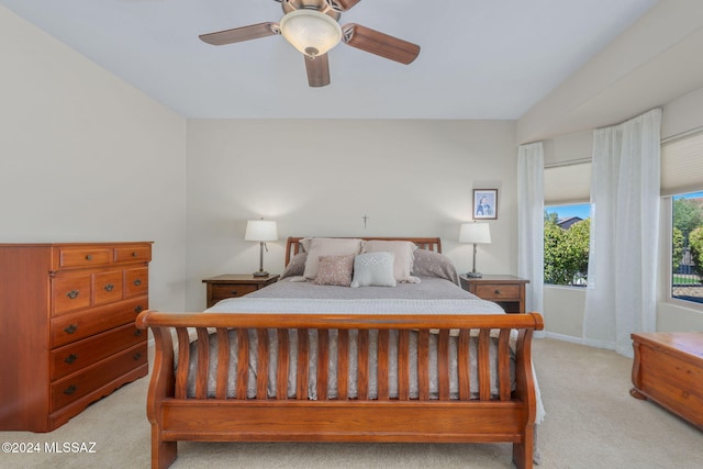 bedroom featuring ceiling fan and light carpet