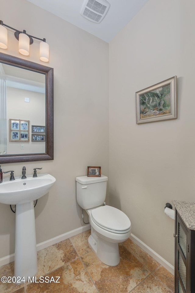 bathroom with toilet and sink