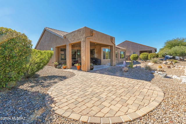 back of house featuring a patio