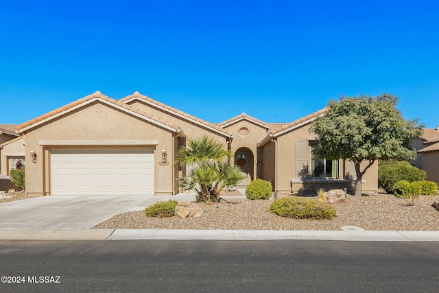 view of front of home with a garage