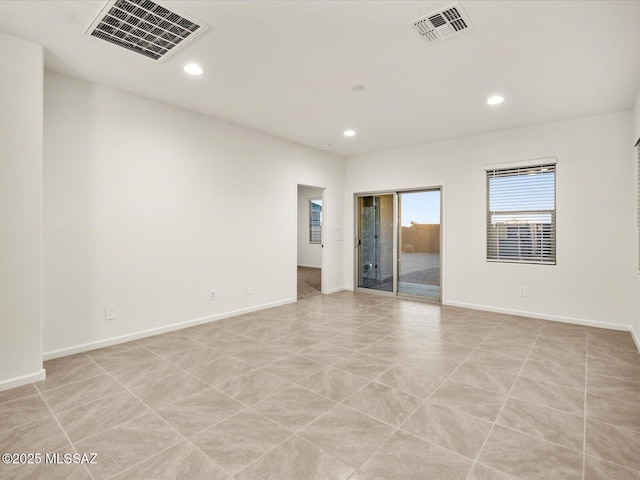 unfurnished room with visible vents, recessed lighting, and baseboards
