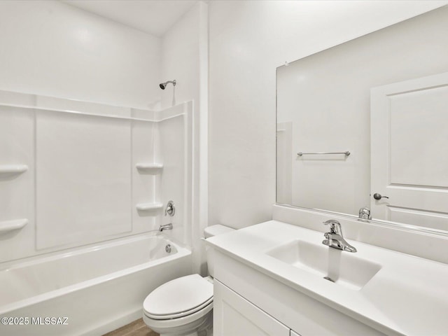 full bathroom featuring vanity, toilet, and  shower combination