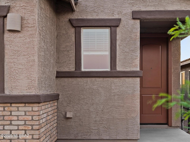 view of home's exterior with stucco siding
