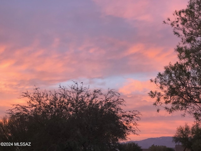 nature at dusk featuring a mountain view