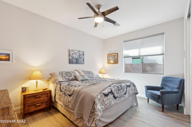 bedroom featuring light hardwood / wood-style flooring and ceiling fan