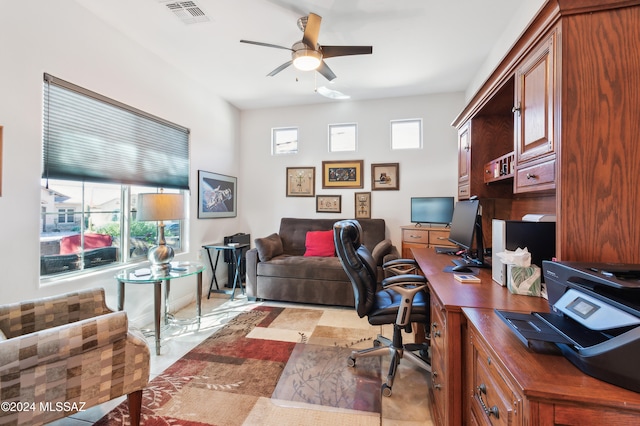 tiled office featuring ceiling fan and a wealth of natural light