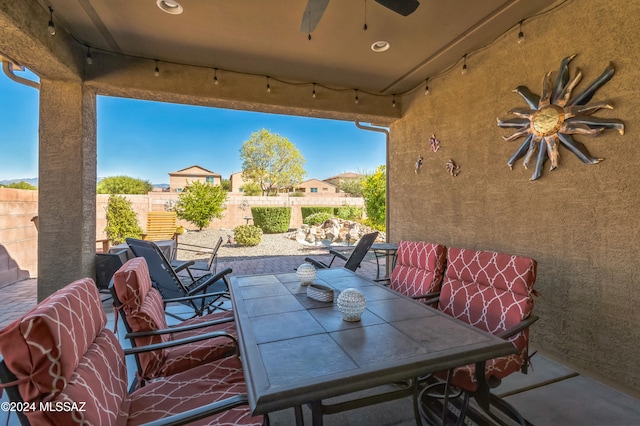 view of patio featuring ceiling fan