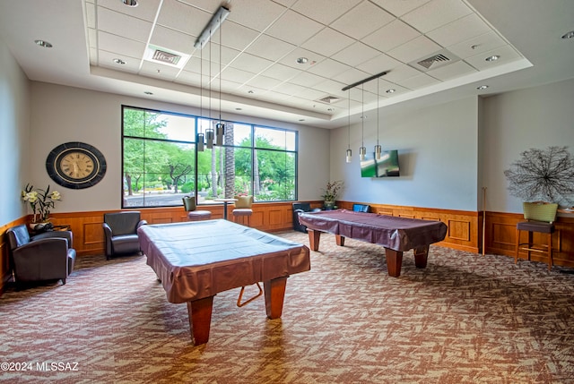 game room featuring carpet, a tray ceiling, wood walls, and pool table