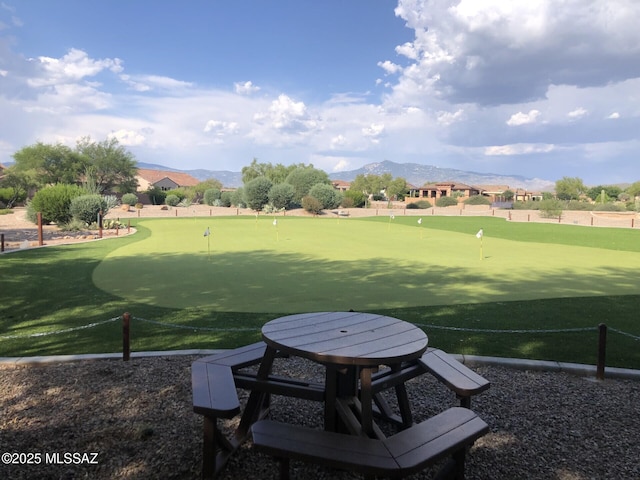 surrounding community featuring a mountain view