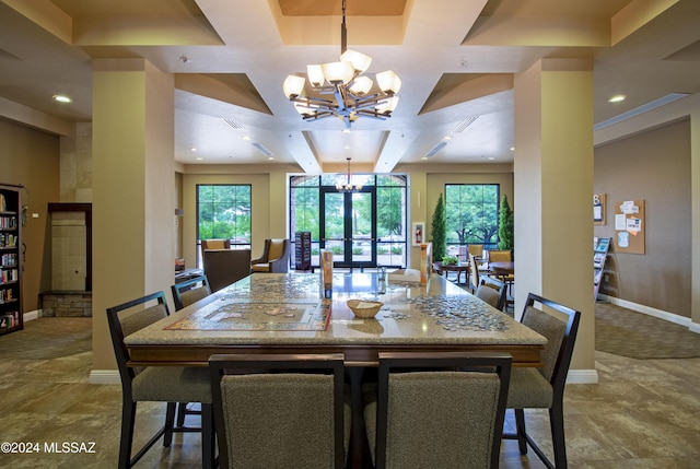 dining space featuring beam ceiling, french doors, a chandelier, and coffered ceiling