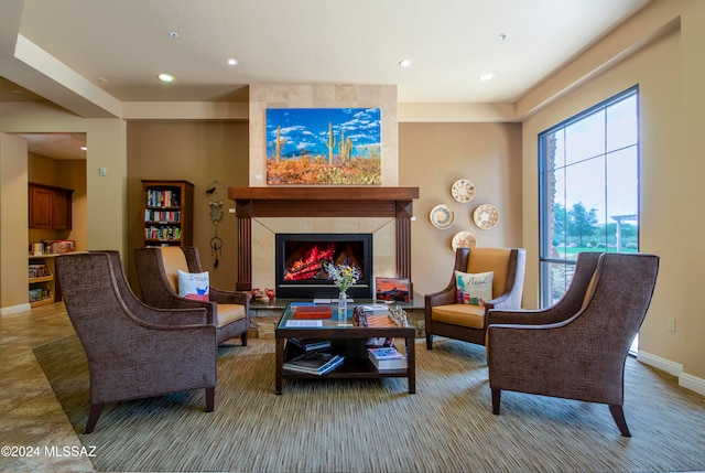 interior space with a tile fireplace