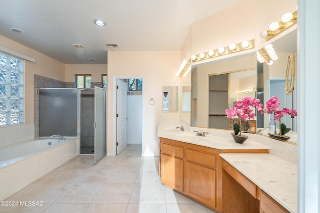 bathroom with separate shower and tub, tile patterned floors, and vanity