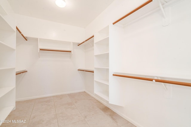 walk in closet featuring light tile patterned floors