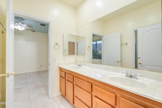 bathroom featuring tile patterned floors, ceiling fan, and vanity