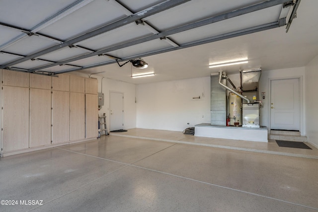 garage featuring electric panel and a garage door opener