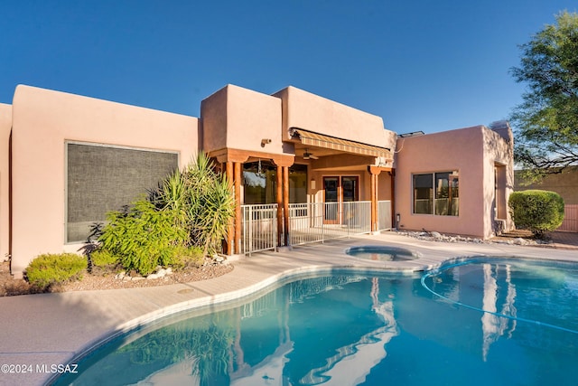 view of pool featuring an in ground hot tub and a patio