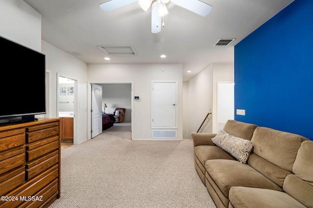 living room with light colored carpet and ceiling fan