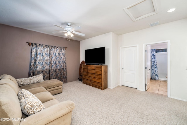 carpeted living room featuring ceiling fan