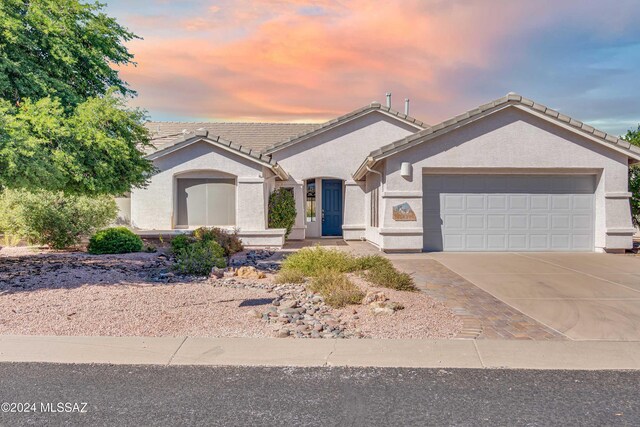 ranch-style house featuring a garage