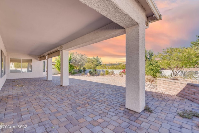 view of patio terrace at dusk