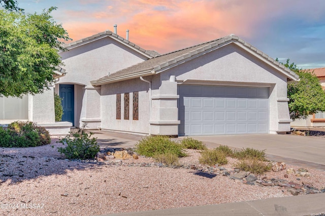 view of front of property featuring a garage