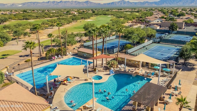 view of pool featuring a patio and a mountain view