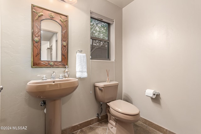 bathroom with tile patterned floors and toilet