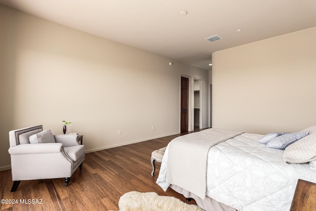 bedroom featuring dark hardwood / wood-style flooring