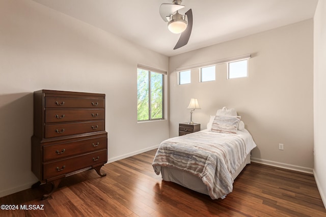 bedroom featuring dark hardwood / wood-style floors and ceiling fan