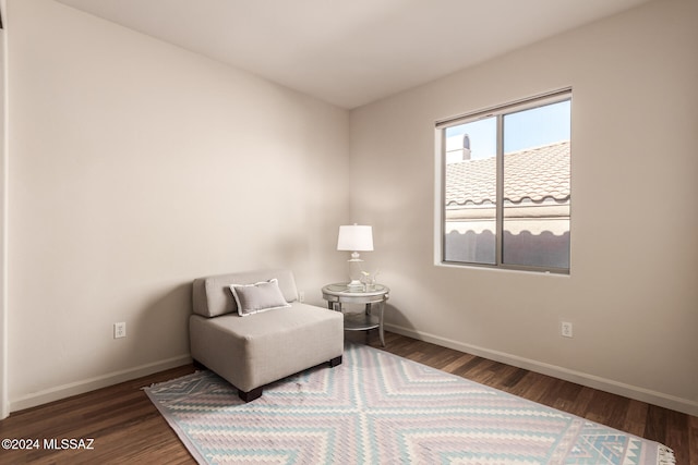 sitting room featuring dark hardwood / wood-style floors