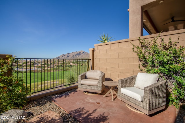 view of patio / terrace with a mountain view