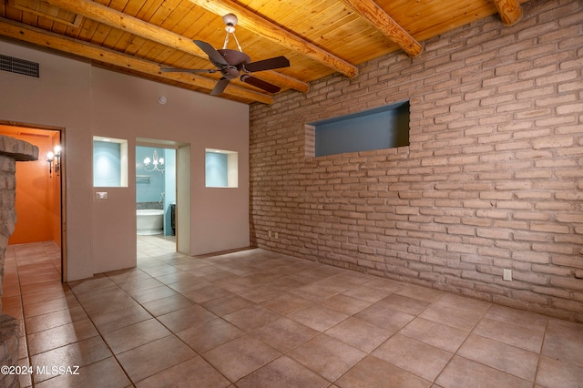 unfurnished room featuring beamed ceiling, light tile patterned flooring, wood ceiling, and brick wall