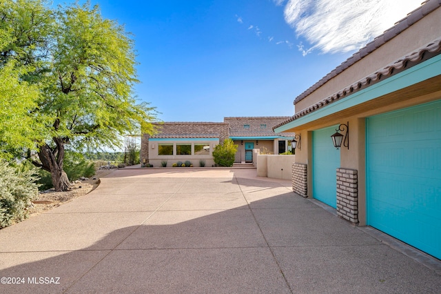 view of patio / terrace featuring a garage