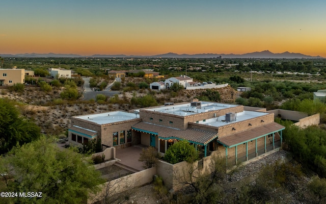 aerial view at dusk with a mountain view