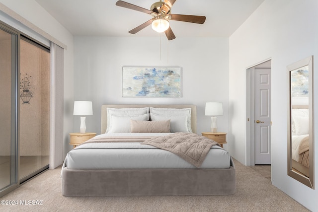 bedroom featuring access to outside, light colored carpet, and ceiling fan