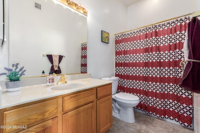 bathroom featuring vanity, tile patterned floors, toilet, and a shower with curtain