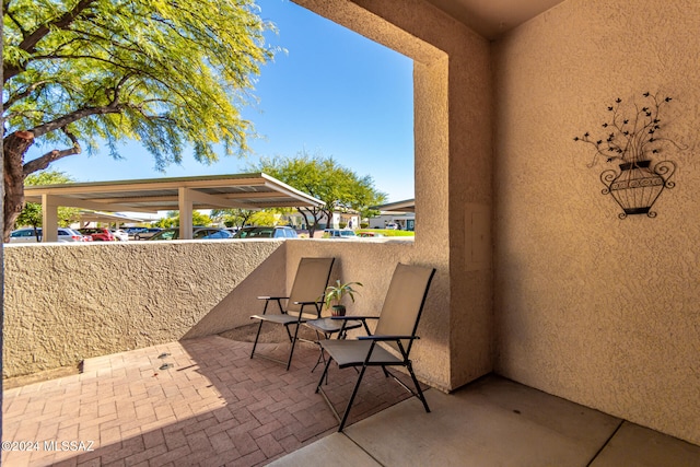 view of patio featuring a balcony