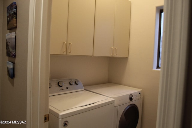 laundry area featuring cabinets and washer and dryer