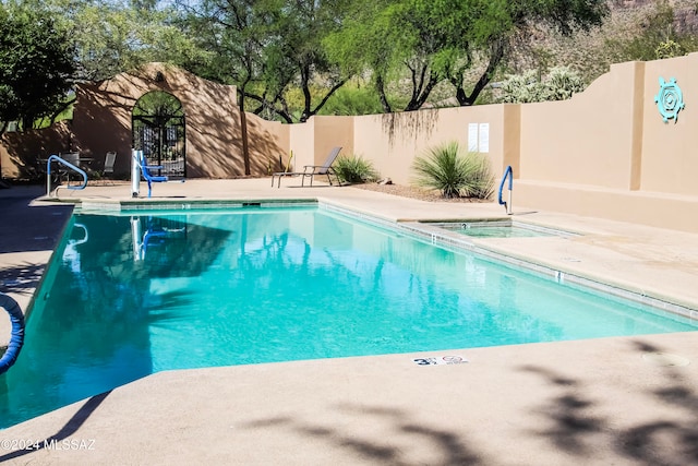 view of pool featuring a patio area