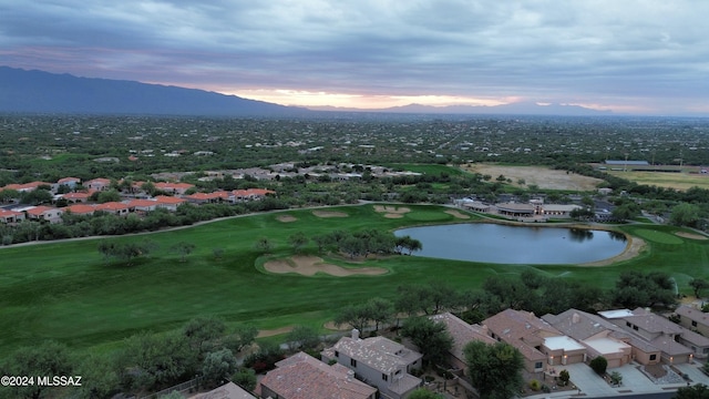 aerial view at dusk with a water and mountain view