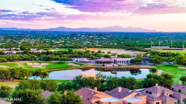 aerial view at dusk with a water and mountain view