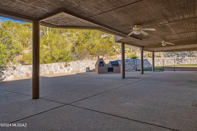 view of patio with ceiling fan and an outdoor kitchen