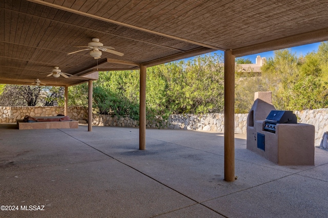 view of patio / terrace featuring ceiling fan and an outdoor kitchen