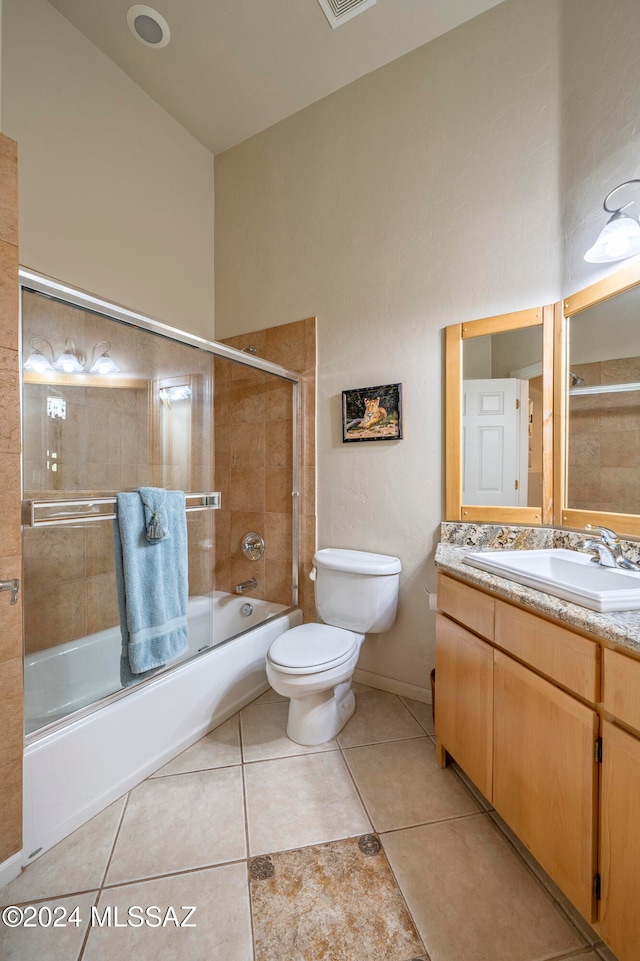 full bathroom featuring tile patterned flooring, vanity, bath / shower combo with glass door, and toilet