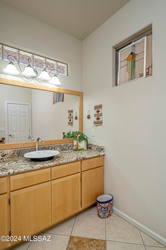 bathroom featuring tile patterned flooring and vanity