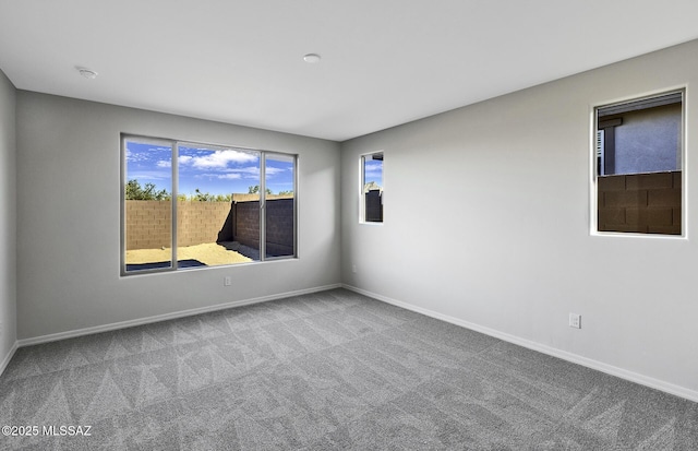 empty room featuring carpet flooring