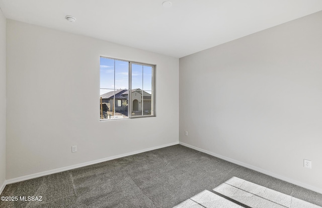 unfurnished room featuring carpet